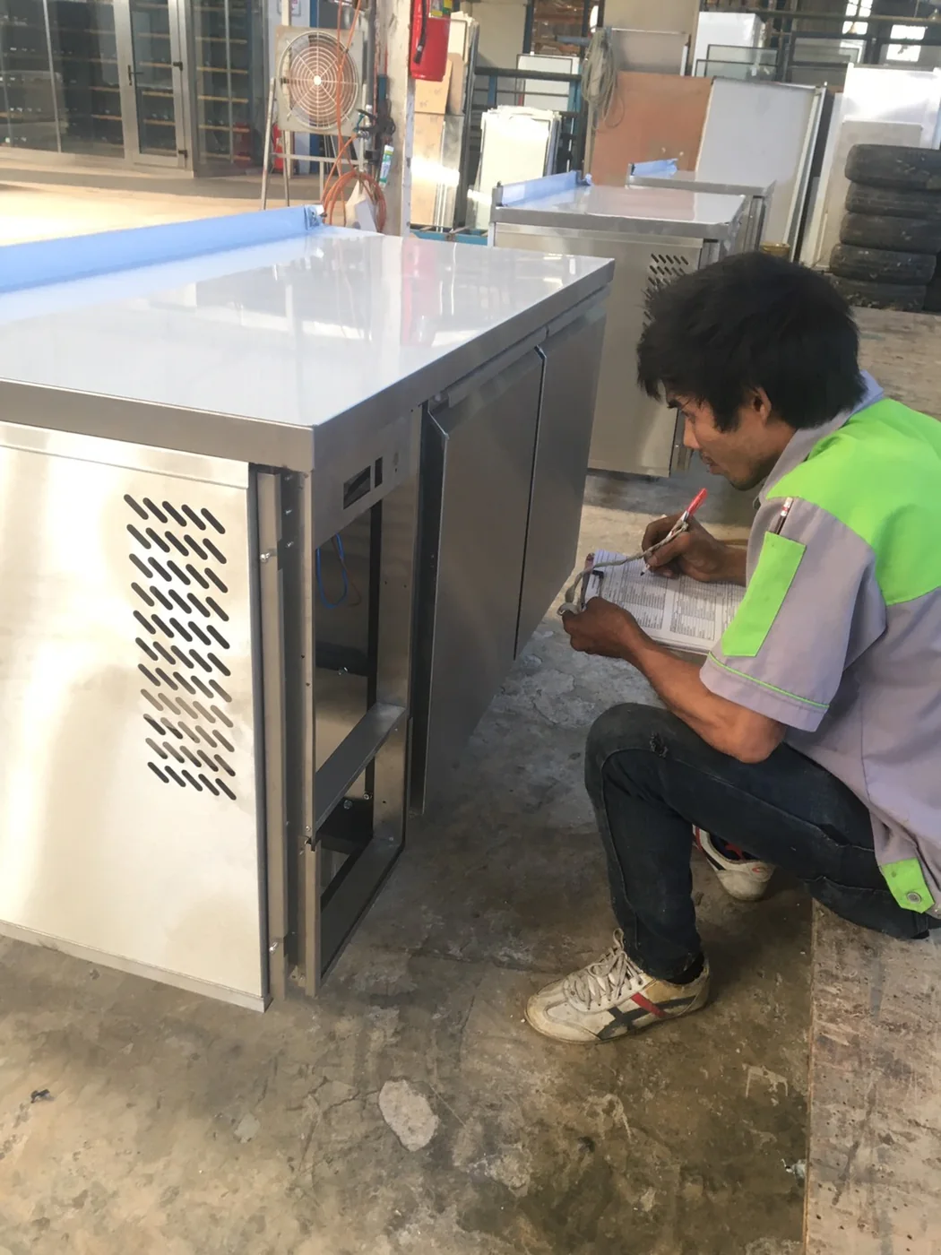Final inspection of stainless undercounter refrigeration